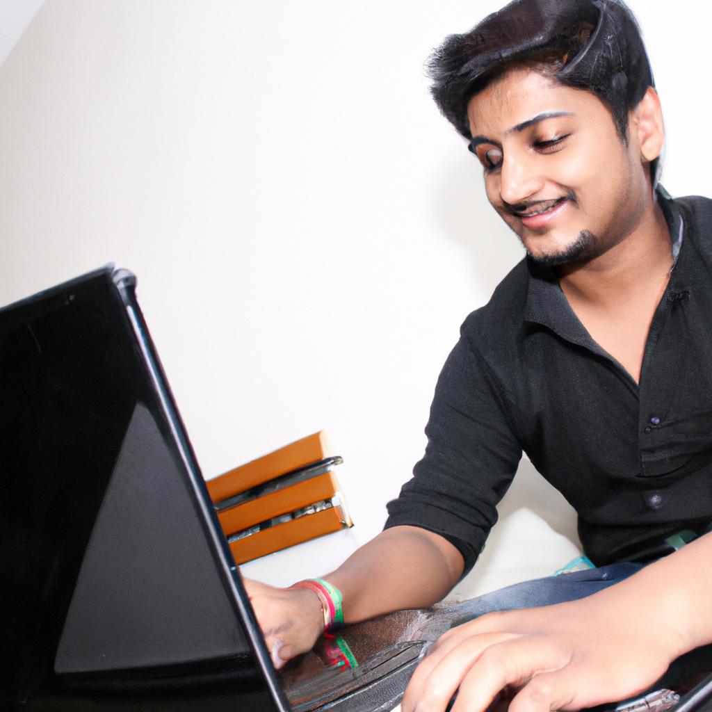 Person typing on laptop, smiling