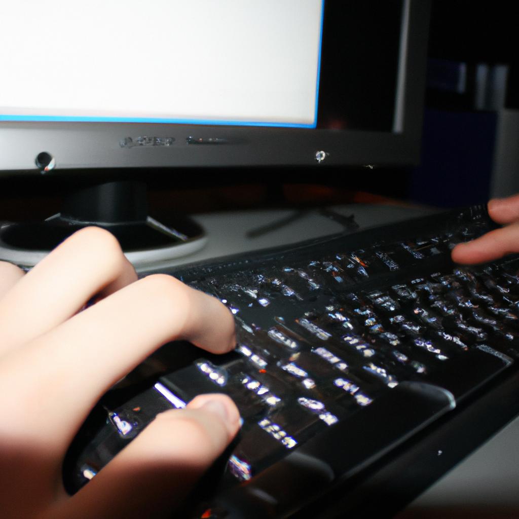 Person typing on computer screen